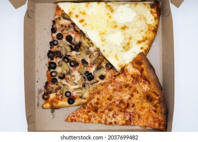 Three Basic New York City Style Pizza Slices In A Takeout Box