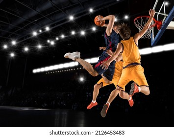 Three Basketball Player Players In Action On Dark Background