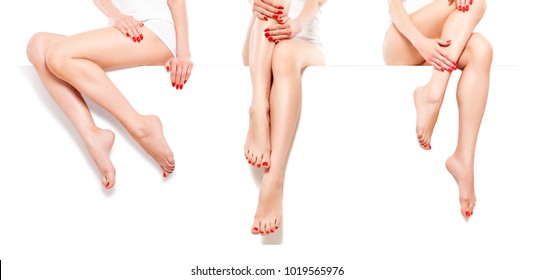 Three Beautiful Slim Womans With Red Manicure, Sitting At Banner, Isolated On White Background