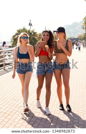 Similar – Image, Stock Photo Two women holding surfboard and looking at camera