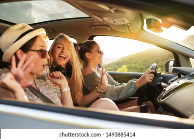 Three Best Female Friends Travel Together.They Drives A Car And Making Fun.Summer Adventure..