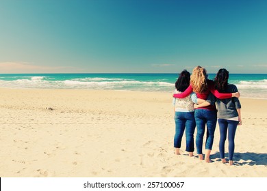 Three Best Friends Walking At Seaside