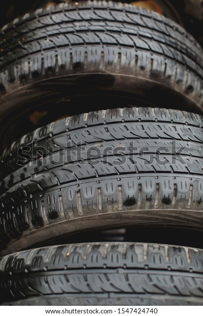 three black car tires\
wheels, macro photo