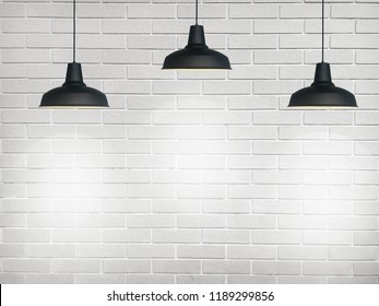 Three Black Fixtures With White Light And Have White Wall Background.