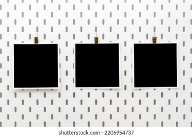 Three Blank Photo Frames With Clips On Peg Board. Template For Photography And Prints