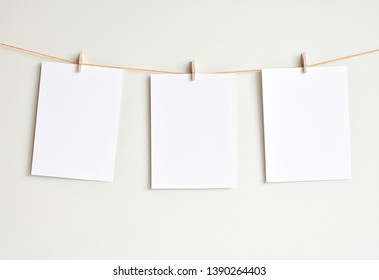 Three Blank White Papers Hanging On The Wall, Mock Up For Artwork, Photos, Poster, Prints.