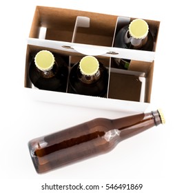 Three bottles of beer with caps and one on side