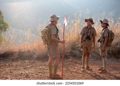 The three Boy Scouts talk to each other before making the long journey to the camp.