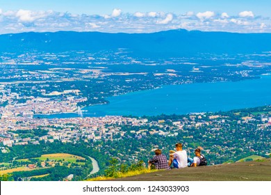 Three boys are overlooking Geneva from Mont Saleve, Switzerland
