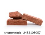 Three bricks made of clay on a white background