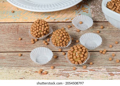 Three Brigadeiros (brigadiers) Of Dulce De Leche With Small Crunchy Balls Of Salted Caramel.