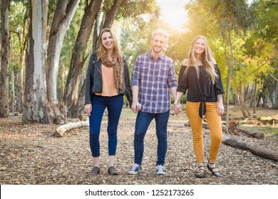 Three Brother And Sisters Portrait Outdoors.