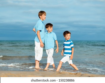 Three Brothers Are Play On Beach, Outdoor