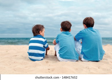 Three Brothers Are Sitting On Beach, Outdoor