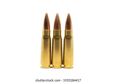 Three bullets isolated on white background. Cartridges 7.62 caliber for Kalashnikov assault rifle closeup