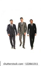 Three Business Men Walking Isolated On White Background