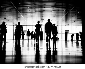 Three Business People Walking Down The Street Talking. Silhouettes.