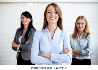 Three Business Women Smiling. Selective Focus