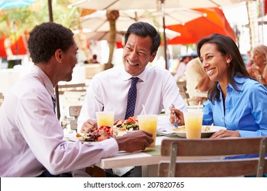 Three Businesspeople Having Meeting In Outdoor Restaurant - Powered by Shutterstock