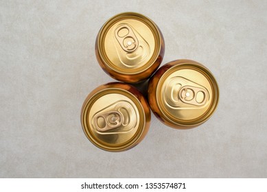 Three Cans Of Ginger Beer Isolated