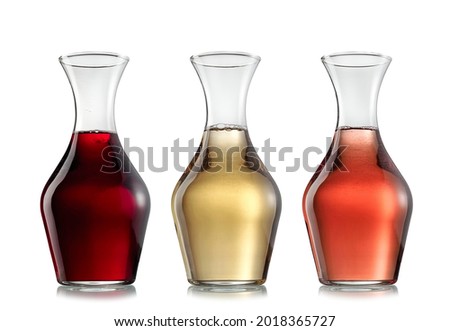 Three carafes with red, white and rose wine on white background Imagine de stoc © 