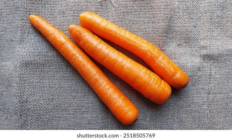 three carrots on the table