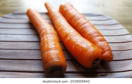 three carrots on the table