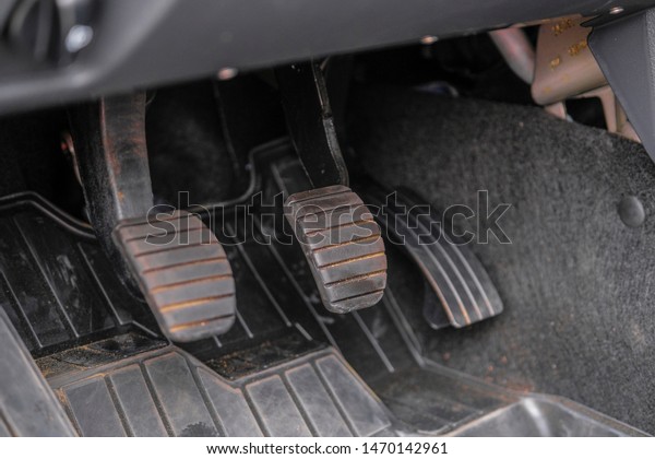 Three car\'s pedals close\
up