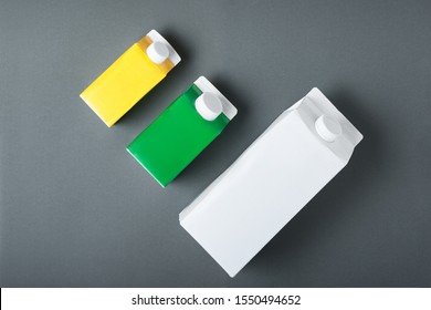 Three Carton Box Or Packaging Of Tetra Pack On Black Background