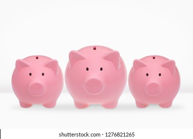Three ceramic piggy banks on a white background. - Shutterstock ID 1276821265