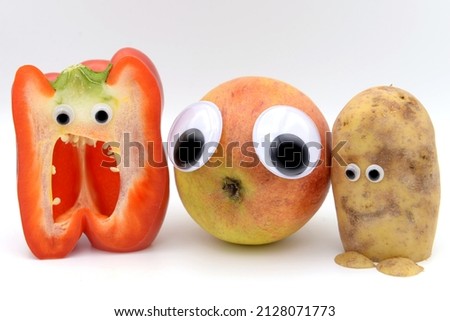 Three Cheeky Fruits are looking at the camera against a white background
