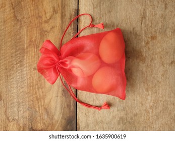 Three Chicken Eggs In Red See Through  Bag