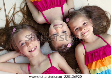Three children closeup top view point