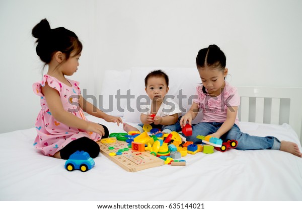 Three Children Playing Toys Bed Bedroom Stock Photo 635144021 ...