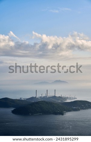 Three chimney of the power plant at Lamma Island, Hong Kong in a foggy day