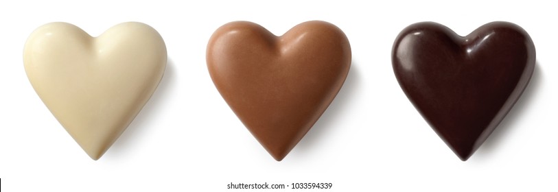 Three Chocolate (milk, Dark And White) Hearts Isolated On White Background. Top View