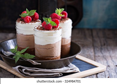 Three chocolate mousse dessert in mason jars