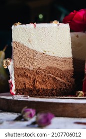 Three Chocolates Cake. Layered Cake With Milk, Black And White Chocolate Souffle. 