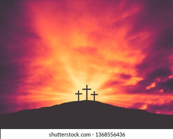 Three Christian Easter Crosses on Hill of Calvary with Colorful Clouds in Sky - Crucifixion of Jesus Christ
