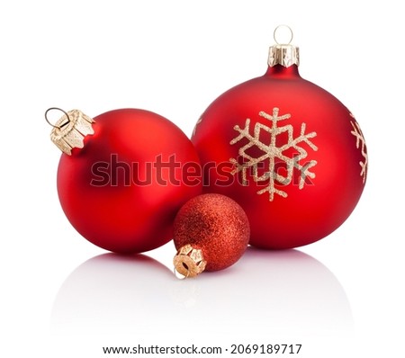 Three Christmas red baubles isolated on a white background