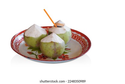 three coconuts placed on white and red tray, on white background, nature, food, copy space