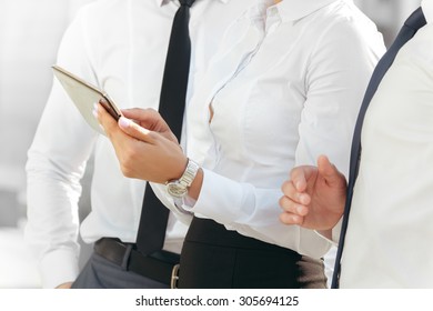 Three Colleagues Analyzing Some Project Stock Photo 305694125