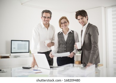 Three Colleagues Take A Break At Office