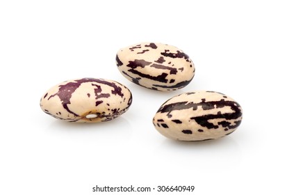 three colored beans on white background