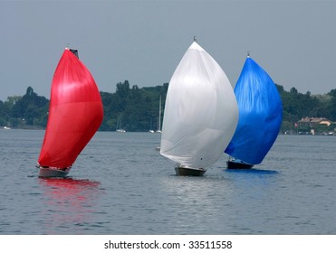 Three Colorful Cruising Sailboats