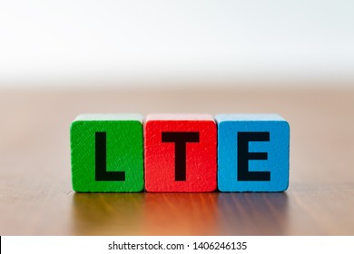 Three Colorful Cubes With The Lettering LTE - Long Term Evolution - As A Symbol For 5g Mobile Communication