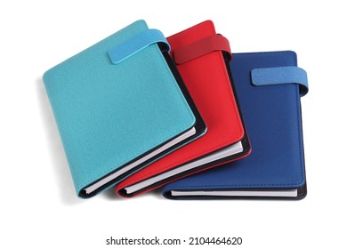 Three Colorful Diaries on White Background