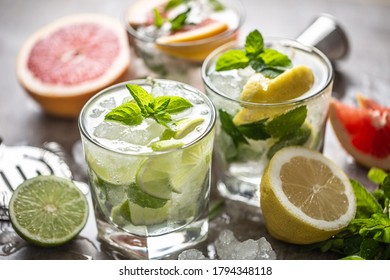 Three Colorful Gin Tonic Cocktails In Whiskey Glasses On Bar Counter In Pup Or Restaurant.