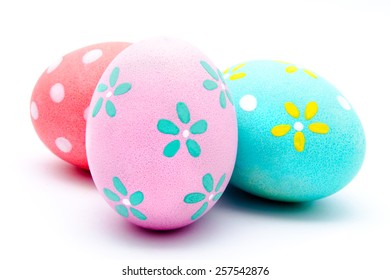 Three colorful handmade easter eggs isolated on a white