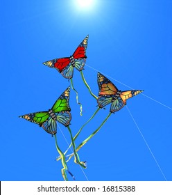 Three Colorful Kites At Sunny Sky